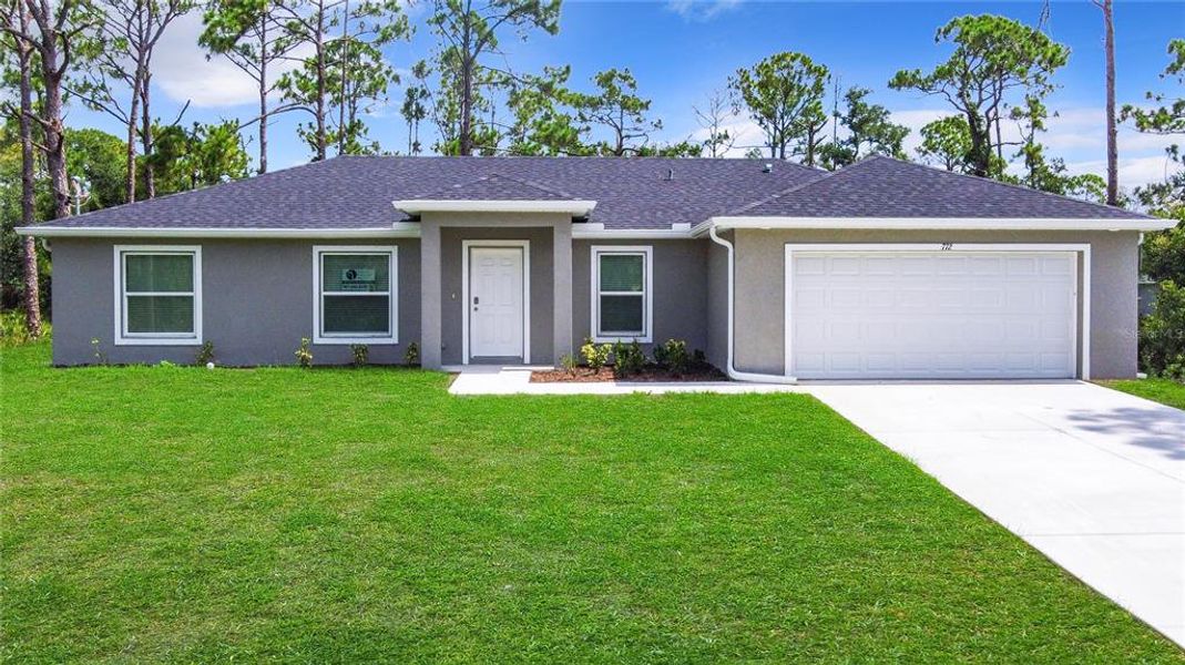 Front exterior of a new home in , Port Charlotte, FL, highlighting curb appeal (Image 1).