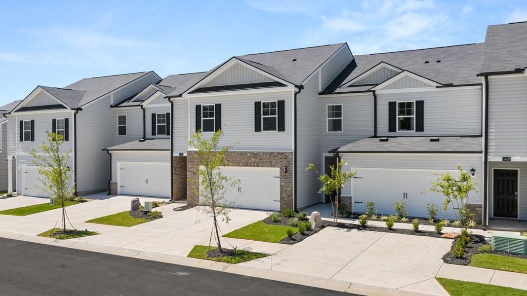 Front exterior of a new home in Rushing Waters Townhomes, North Augusta, SC, highlighting curb appeal (Image 2). Front exterior of a new home in Rushing Waters Townhomes, North Augusta, SC, highlighting curb appeal (Image 2).