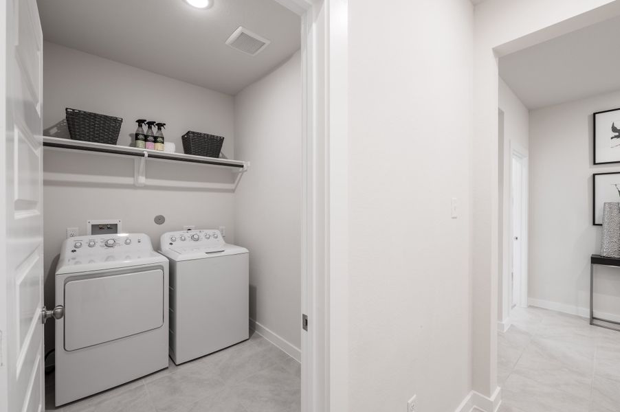 Representative furnished interior of a home built from the Caddo by Tri Pointe Homes in Mason Woods, Cypress (Image 32).