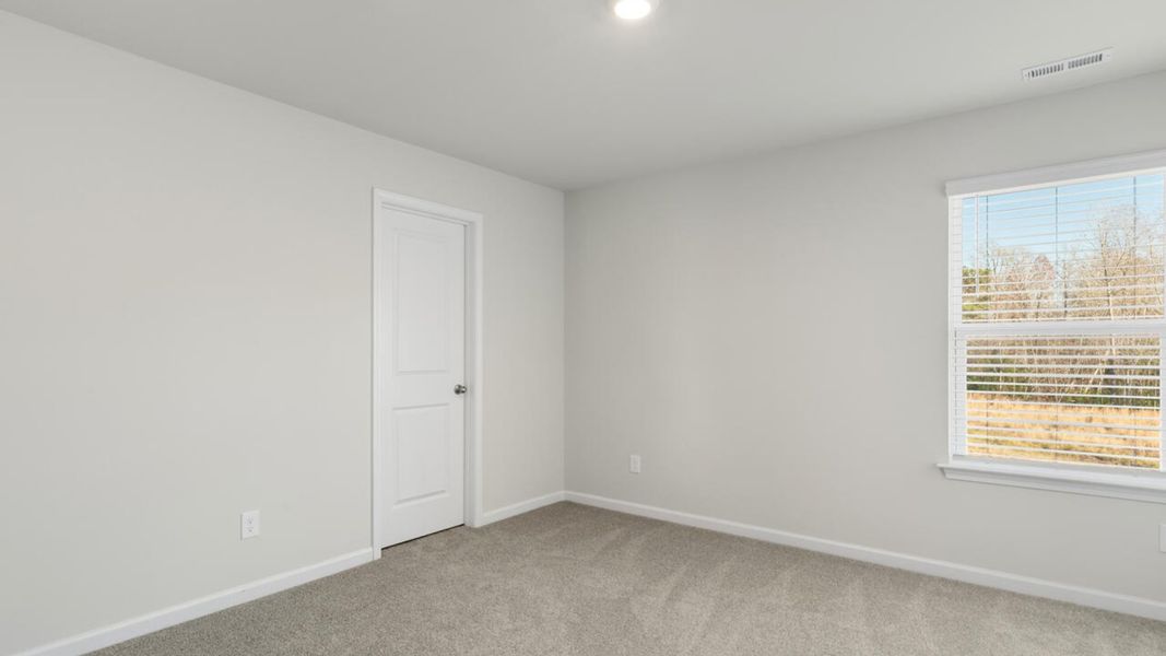 Representative unfurnished interior of a home built from the TILLMAN by D.R. Horton in Surfside Landing, Hubert (Image 48).