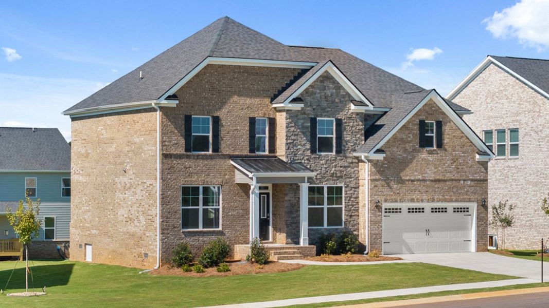 Front exterior of a new home in Heritage Pointe, Senoia, GA, highlighting curb appeal (Image 1). Front exterior of a new home in Heritage Pointe, Senoia, GA, highlighting curb appeal (Image 1).