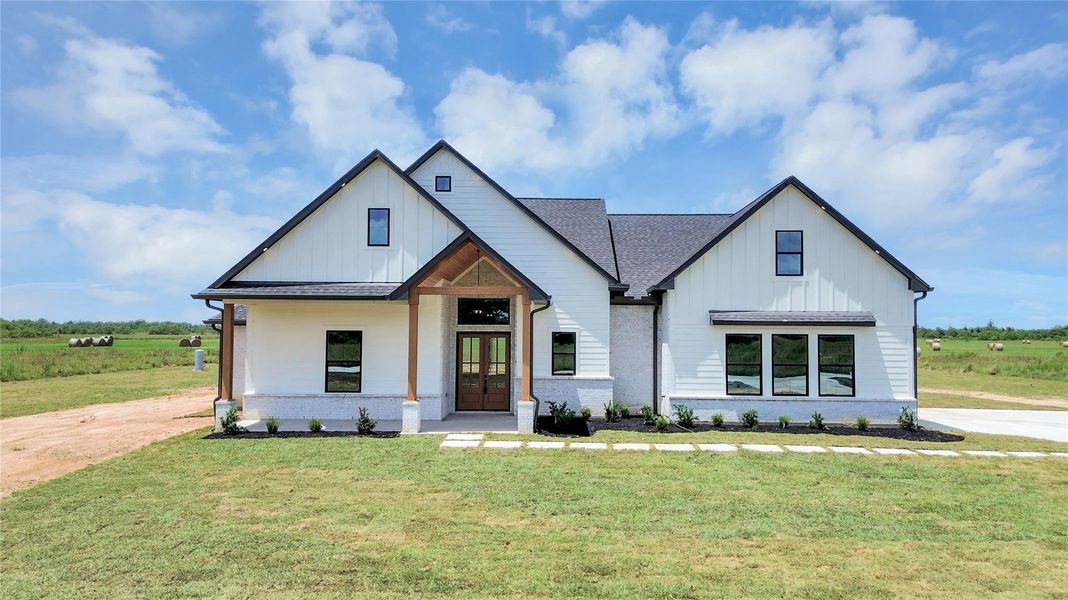 Front exterior of a new home in , Dayton, TX, highlighting curb appeal (Image 27). Front exterior of a new home in , Dayton, TX, highlighting curb appeal (Image 27).