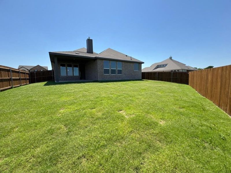 Exterior details and patio area of a home in Cedar Ridge Estates, Anna (Image 3).