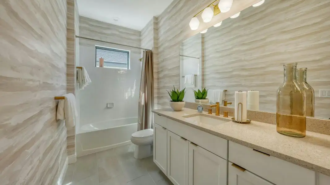 Furnished interior view inside a new home in Kingston South Real Estate and Homes for Sale in Estero, FL - Neal Communities, Estero (Image 17).