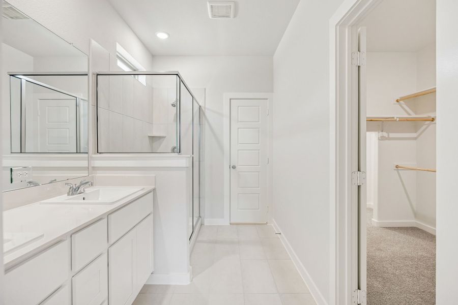 Primary Bathroom in the Stanley II home plan by Trophy Signature Homes – REPRESENTATIVE PHOTO