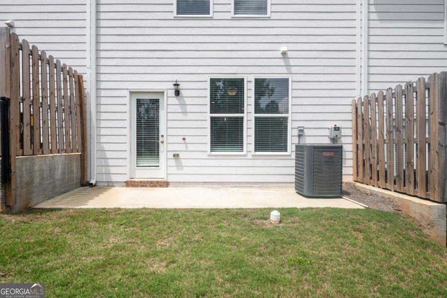 Exterior details and patio area of a home in Chimney Oaks Townhomes, Homer (Image 30). Exterior details and patio area of a home in Chimney Oaks Townhomes, Homer (Image 30).