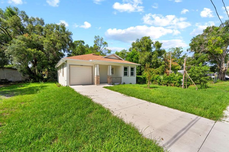 Front exterior of a new home in , Tampa, FL, highlighting curb appeal (Image 16). Front exterior of a new home in , Tampa, FL, highlighting curb appeal (Image 16).