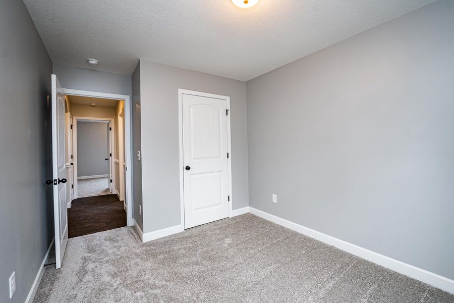 Representative unfurnished interior of a home built from the Saxon by Enchanted Homes in Guadalupe Heights, Seguin (Image 42).