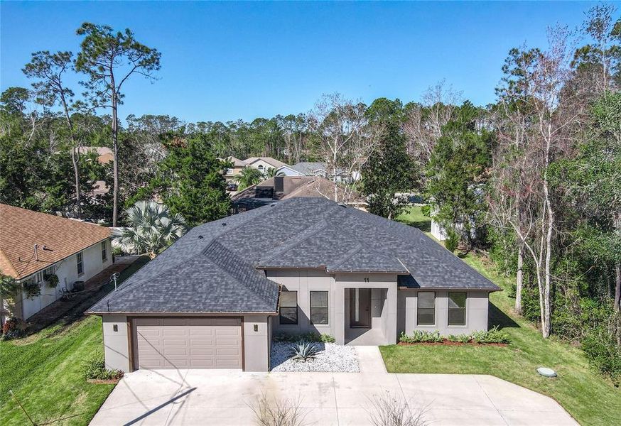 Front exterior of a new home in , Palm Coast, FL, highlighting curb appeal (Image 30).