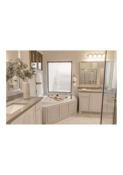 Bathroom featuring a tub to relax in and vanity