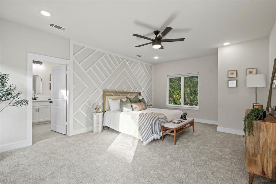 Bedroom featuring light colored carpet, ceiling fan, recessed lighting, and ensuite bathroom Bedroom featuring light colored carpet, ceiling fan, recessed lighting, and ensuite bathroom