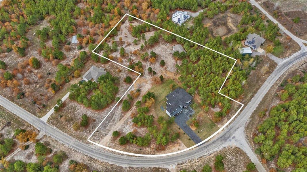 Aerial view with property boundaries highlighted Aerial view with property boundaries highlighted