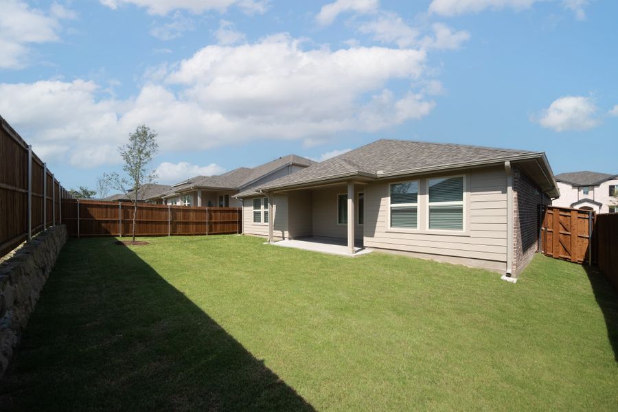 Exterior details and patio area of a home in The Villages of Hurricane Creek, Anna (Image 2).