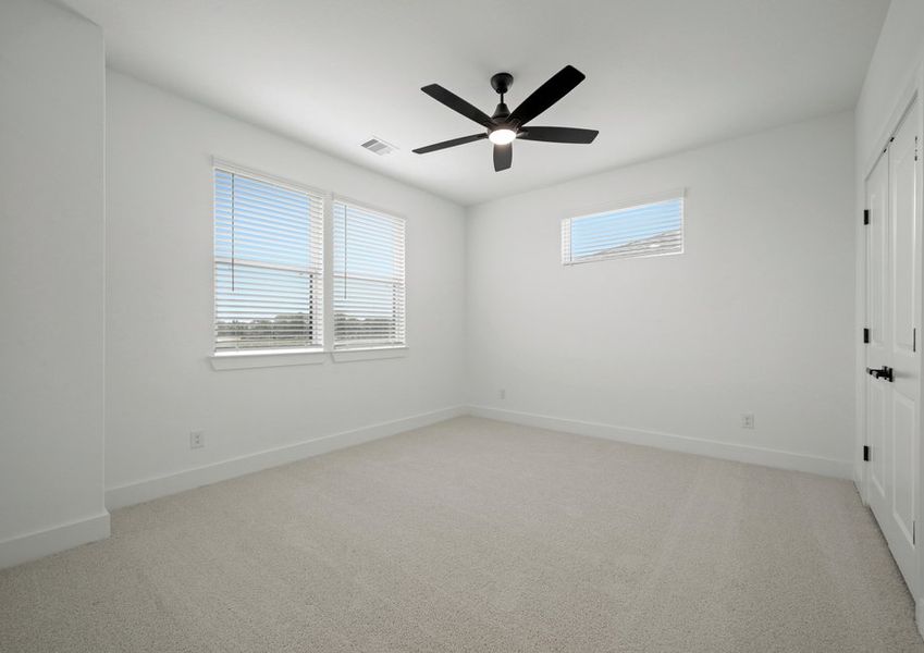 Large secondary bedrooms are found throughout the home.