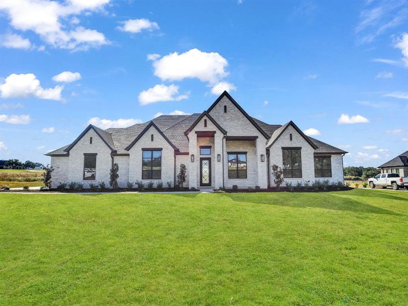 View of front of home with a front lawn