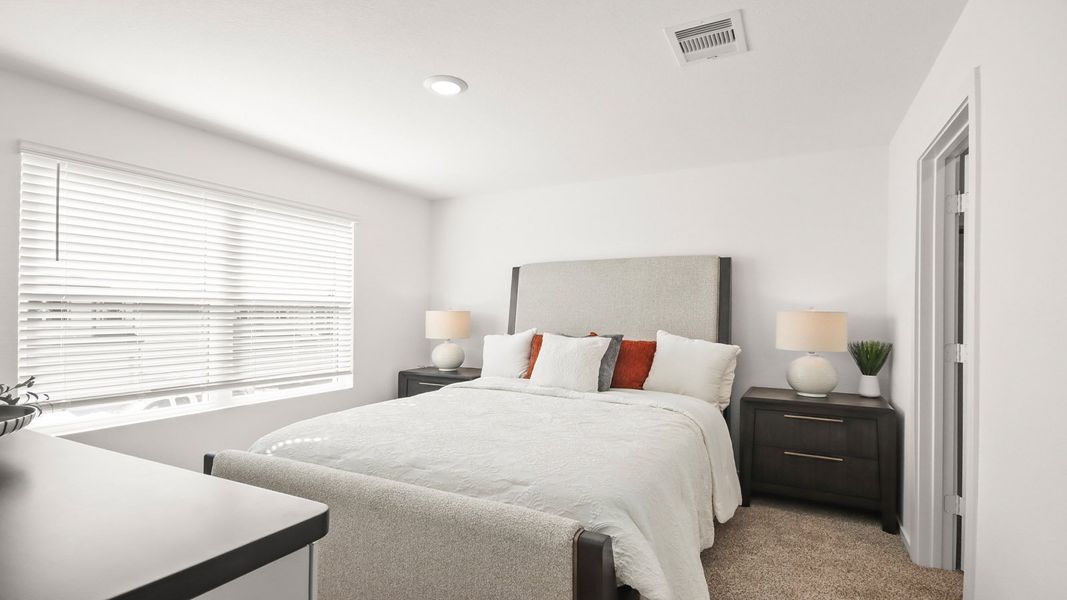 Representative furnished interior of a home built from the 1293 by D.R. Horton in Bridges on Lake Houston Villas, Humble (Image 16).