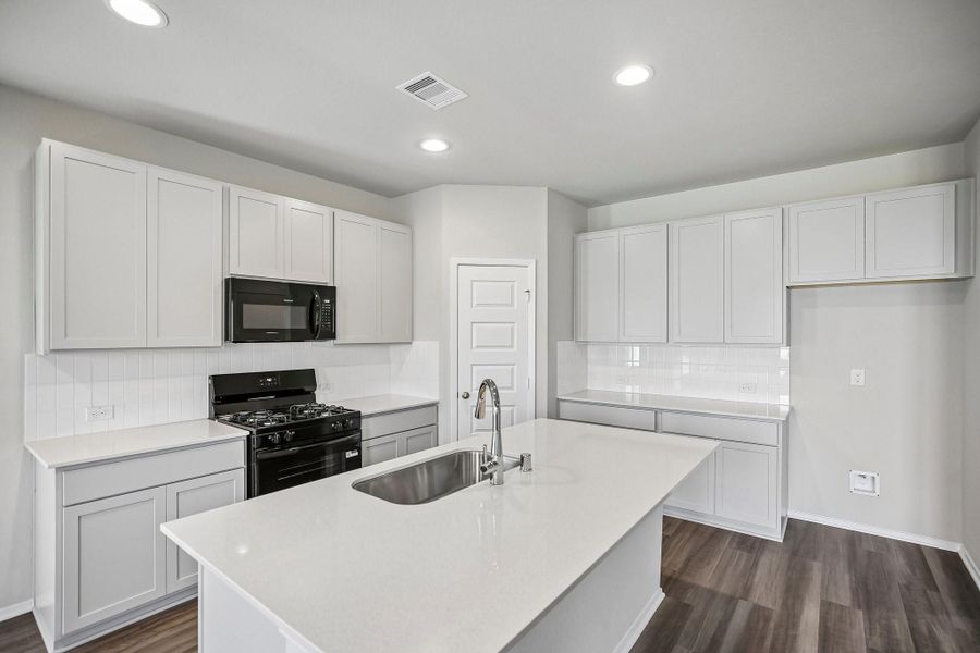 Whip up a batch of Grandma's secret cookies recipe in this sleek stunner of a kitchen!