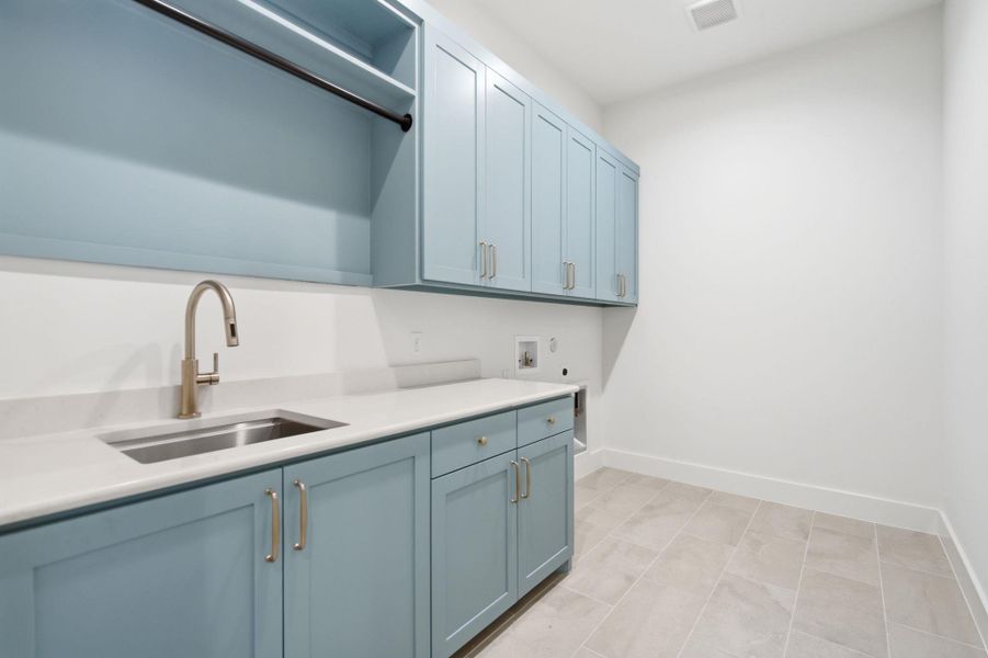 Ample counter space and clean cabinetry define this functional workspace.
