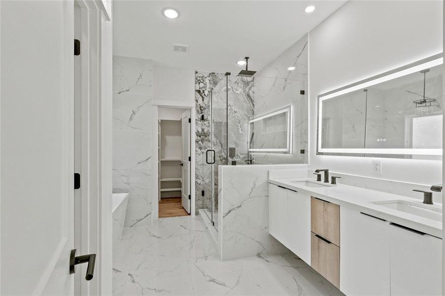 Bathroom with walk in shower and vanity