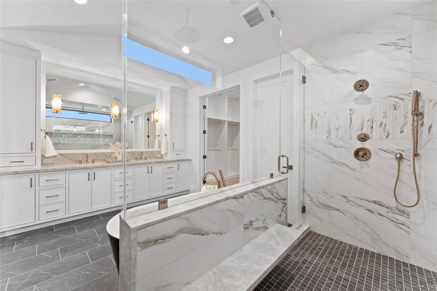 Spa-like bathroom with floating bench and rain showers