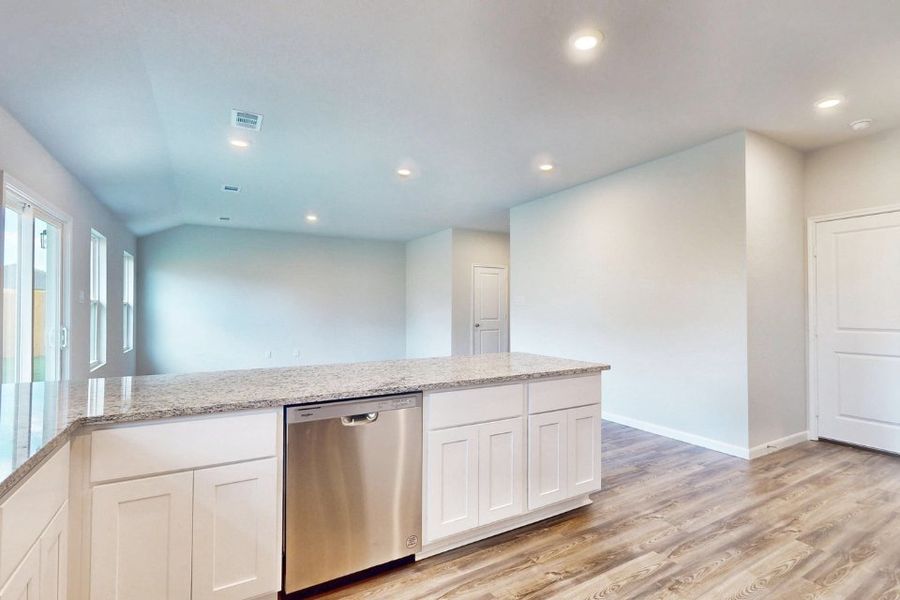 A kitchen with white cabinets. A kitchen with white cabinets.
