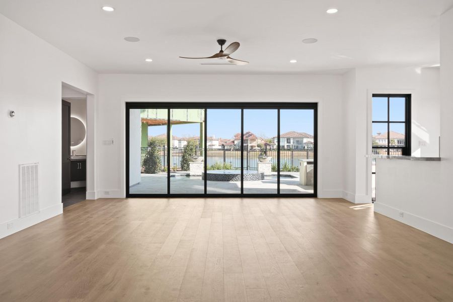 An entertainers dream. This oversized game room can be used as a formal living room. It has accordion glass sliding doors that open up, expanding this room right into the back yard. Direct access to a wet bar, powder bath, garage, and outdoor entertaining. An entertainers dream. This oversized game room can be used as a formal living room. It has accordion glass sliding doors that open up, expanding this room right into the back yard. Direct access to a wet bar, powder bath, garage, and outdoor entertaining.