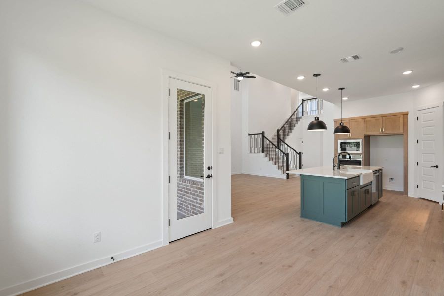 Furnished interior view inside a new home in Wolf Ranch, Georgetown (Image 14).