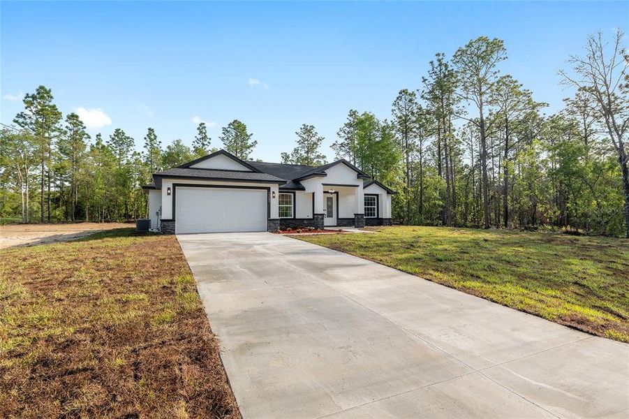 Front exterior of a new home in , Dunnellon, FL, highlighting curb appeal (Image 28).