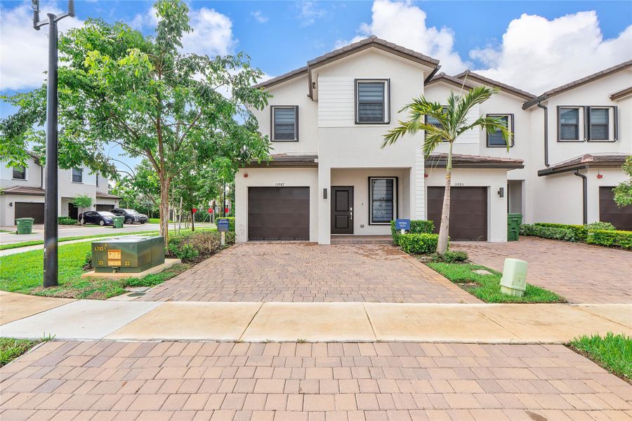 Front exterior of a new home in , Pembroke Pines, FL, highlighting curb appeal (Image 2).