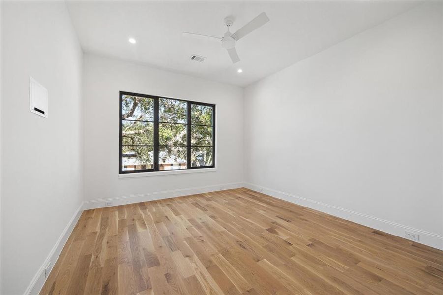 One of the Upstairs Secondary Bedrooms. All bedrooms have in-wall TV boxes.