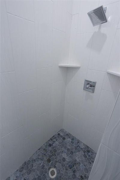 Bathroom with a tile shower