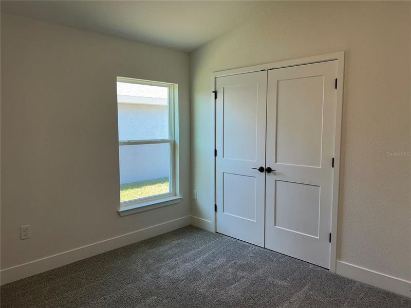 Spacious, unfurnished interior of a new home in Watercress Cove, North Port (Image 17).