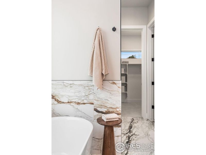 Tiled walls and heated floors in the primary bath