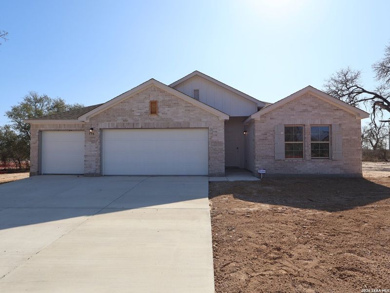 Front exterior of a new home in Jordan's Ranch, San Antonio, TX, highlighting curb appeal (Image 21).