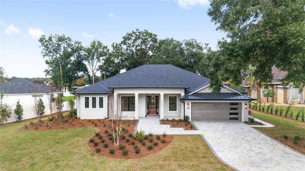 Front exterior of a new home in , Ocala, FL, highlighting curb appeal (Image 27).