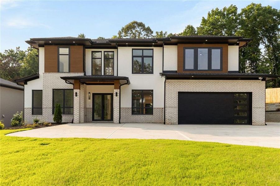 Front exterior of a new home in , Sugar Hill, GA, highlighting curb appeal (Image 31). Front exterior of a new home in , Sugar Hill, GA, highlighting curb appeal (Image 31).