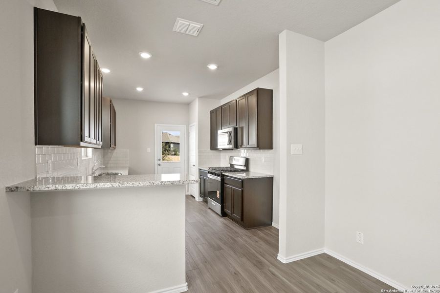 Furnished interior view inside a new home in Blue Ridge Ranch, San Antonio (Image 6).