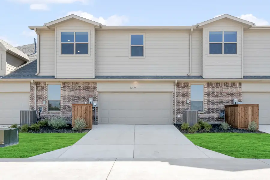 Front exterior of a new home in Cottonwood Creek, Rowlett, TX, highlighting curb appeal (Image 26). Front exterior of a new home in Cottonwood Creek, Rowlett, TX, highlighting curb appeal (Image 26).