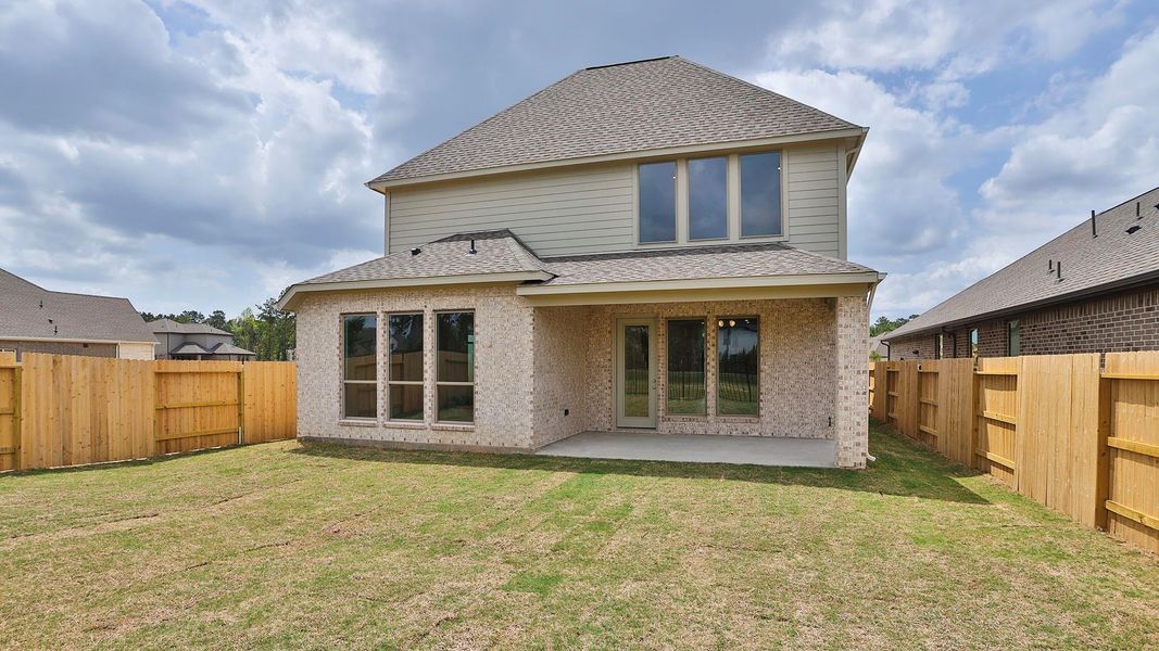Exterior details and patio area of a home in Artavia, Conroe (Image 2).