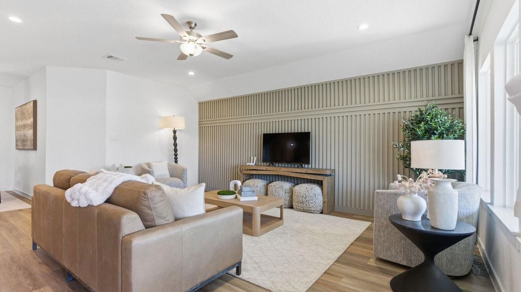 A cozy living room featuring a comfortable couch, a stylish coffee table, and an elegant painting on the wall. A cozy living room featuring a comfortable couch, a stylish coffee table, and an elegant painting on the wall.