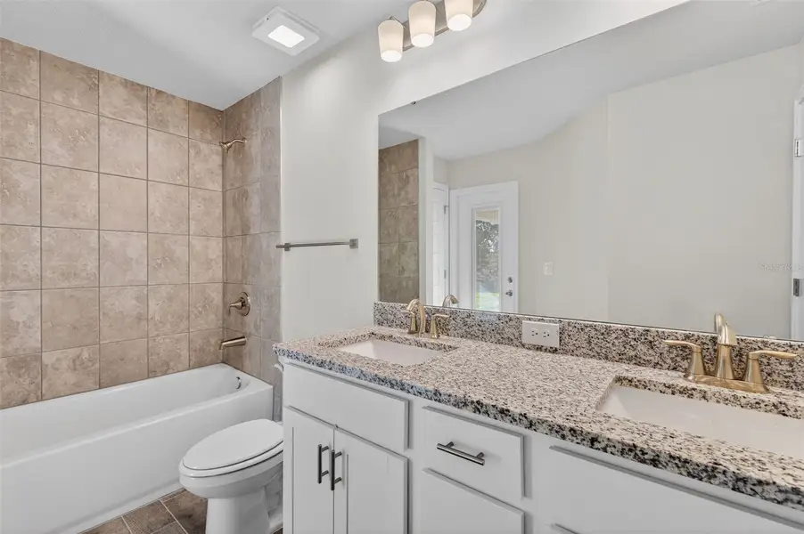 Furnished interior view inside a new home in Hill Country Estates, Dade City (Image 9).