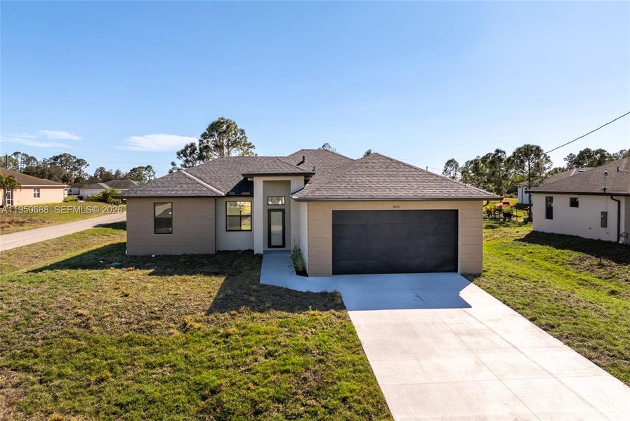 Front exterior of a new home in , Lehigh Acres, FL, highlighting curb appeal (Image 1). Front exterior of a new home in , Lehigh Acres, FL, highlighting curb appeal (Image 1).