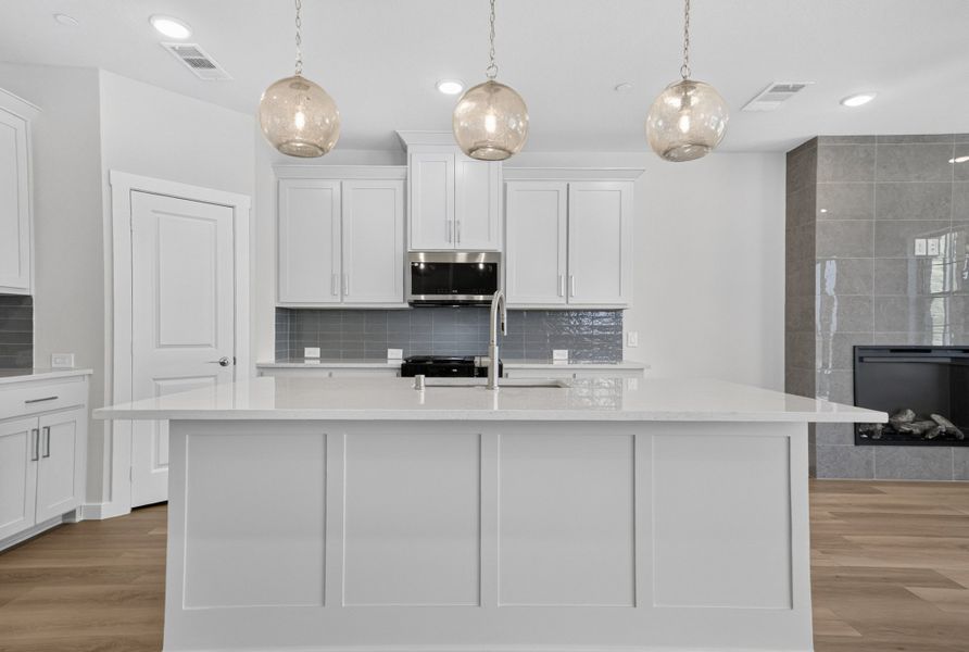 Furnished interior view inside a new home in The Tribute, The Colony (Image 8).