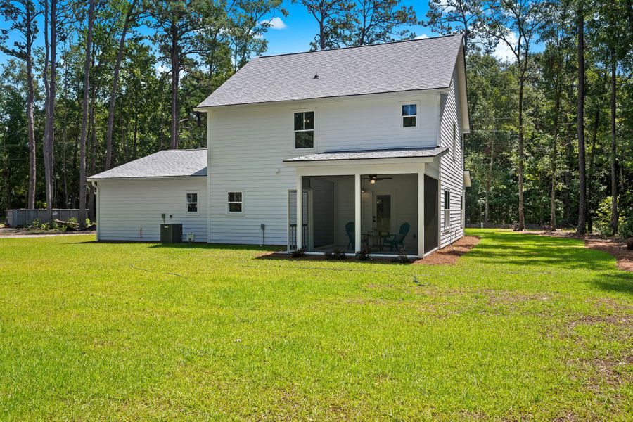 Exterior details and patio area of a home in , Johns Island (Image 27).