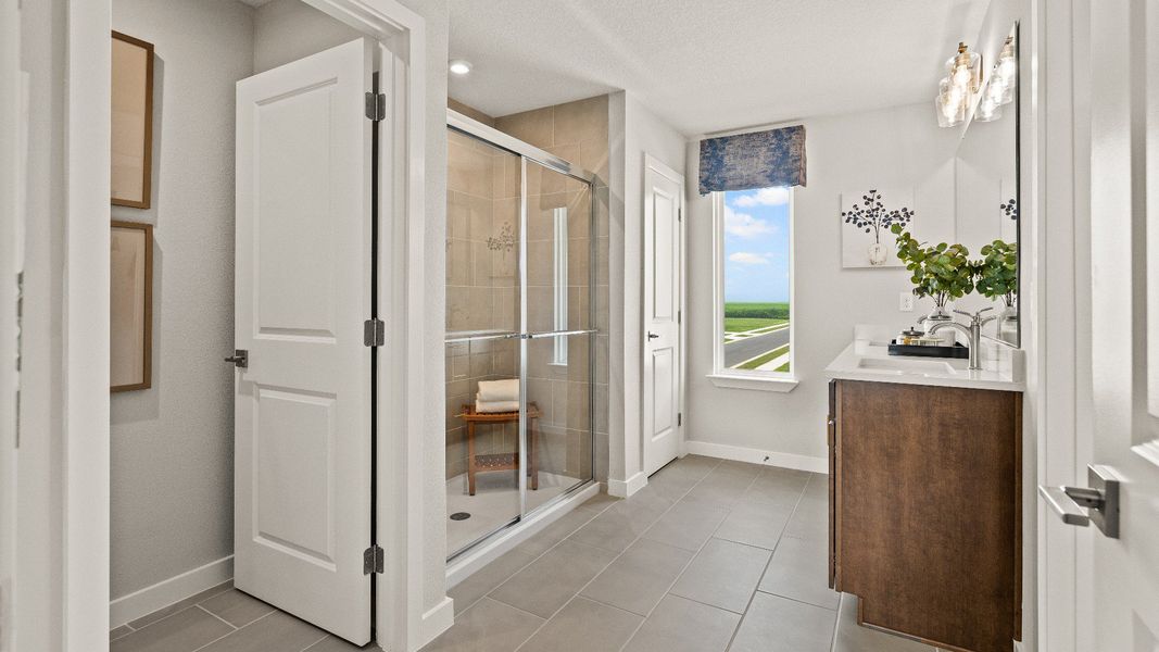 Primary Suite en suite Bathroom in the Model Highbourne by DRB Homes in Hamilton Bluff located in Haines City, FL. Primary Suite en suite Bathroom in the Model Highbourne by DRB Homes in Hamilton Bluff located in Haines City, FL.