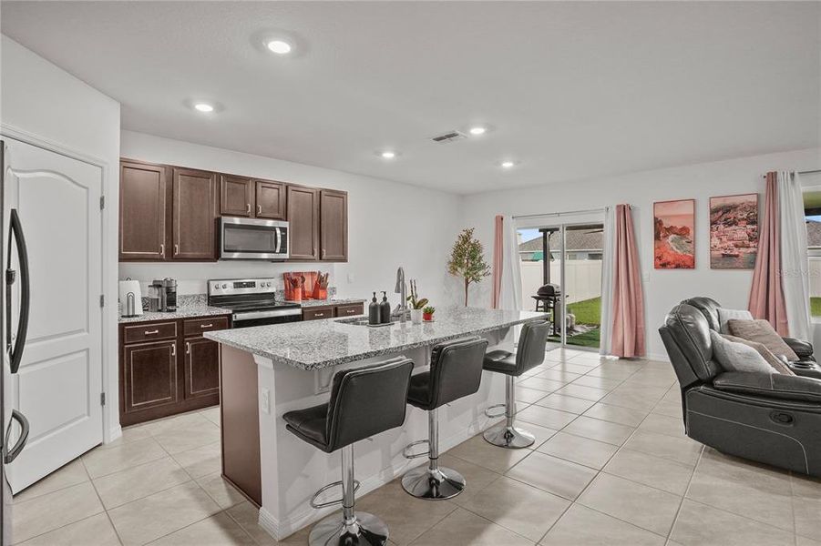 Dreamy kitchen with the rich cabinetry and granite countertops and breakfast nook too. Dreamy kitchen with the rich cabinetry and granite countertops and breakfast nook too.