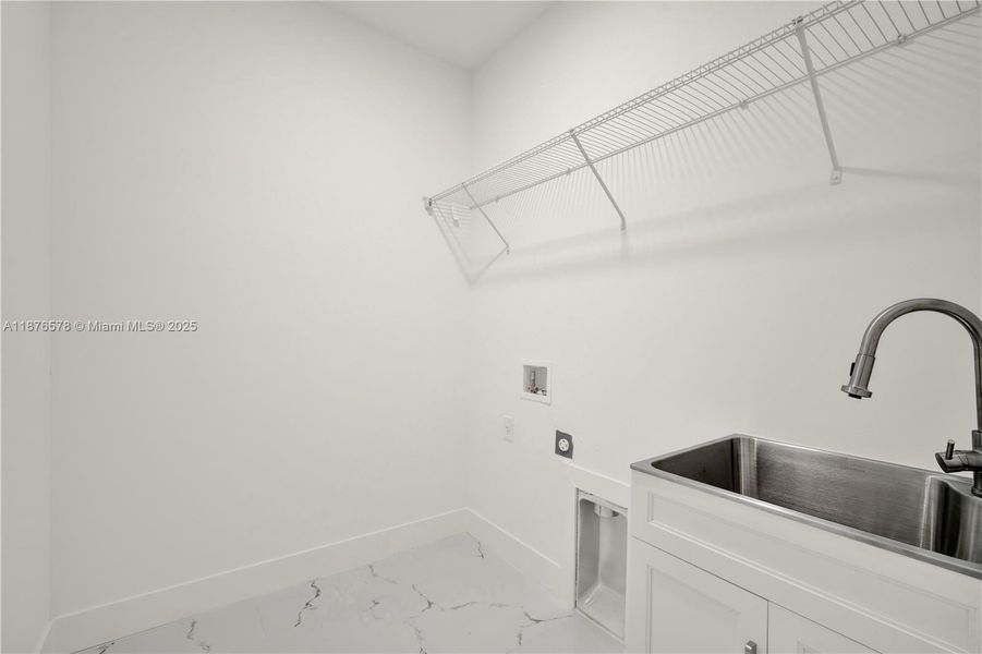 Laundry room with sink