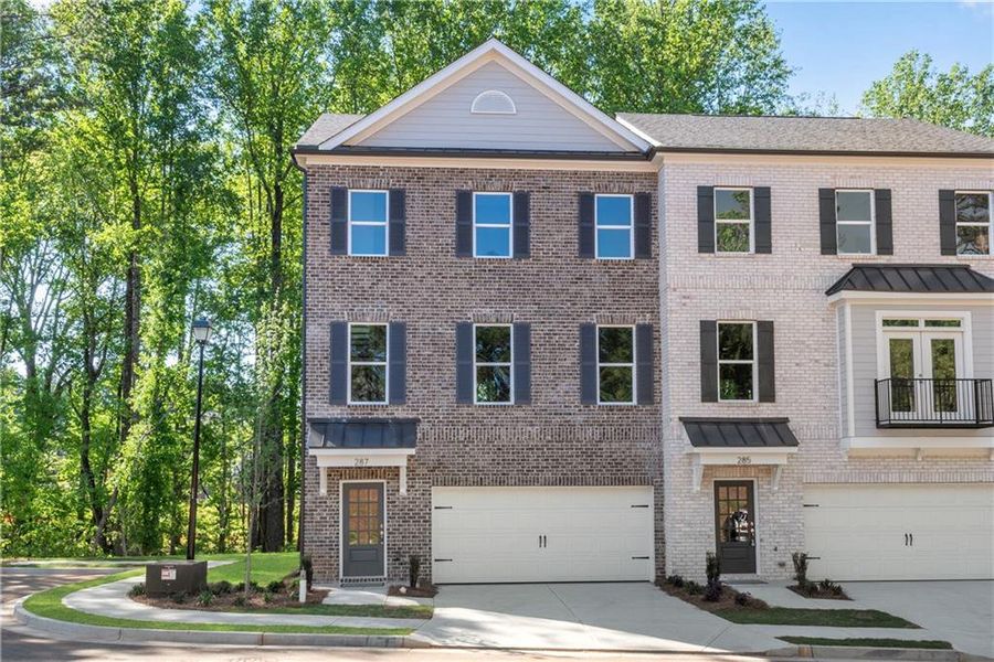 Front exterior of a new home in , Suwanee, GA, highlighting curb appeal (Image 1). Front exterior of a new home in , Suwanee, GA, highlighting curb appeal (Image 1).