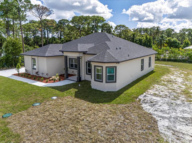 Exterior details and patio area of a home in , The Acreage (Image 34). Exterior details and patio area of a home in , The Acreage (Image 34).