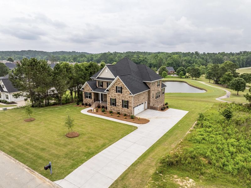 Front exterior of a new home in Mount Vintage, North Augusta, SC, highlighting curb appeal (Image 1).